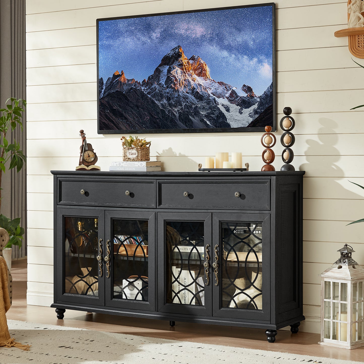 Black farmhouse sideboard cabinet with four glass doors, two drawers, and decor on top