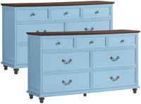 Blue nightstand set with multiple drawers and round knob pulls on caster feet