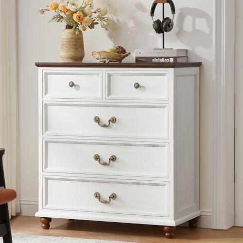 White nightstand with three drawers and decorative metal knob pulls, turned feet