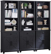 Navy blue farmhouse bookcase with barn doors, multiple open shelves, and drawer-like panels