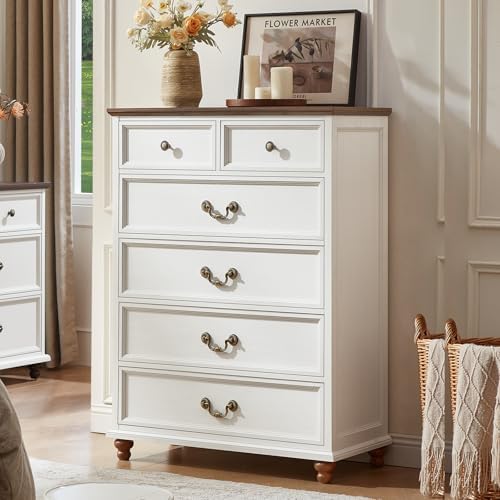 White nightstand cabinet with four drawers and ornate metal knob pulls
