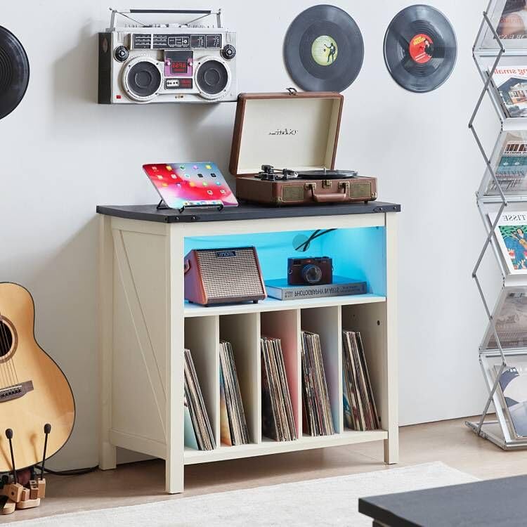 White record player stand with open vinyl shelves and blue LED lighted storage