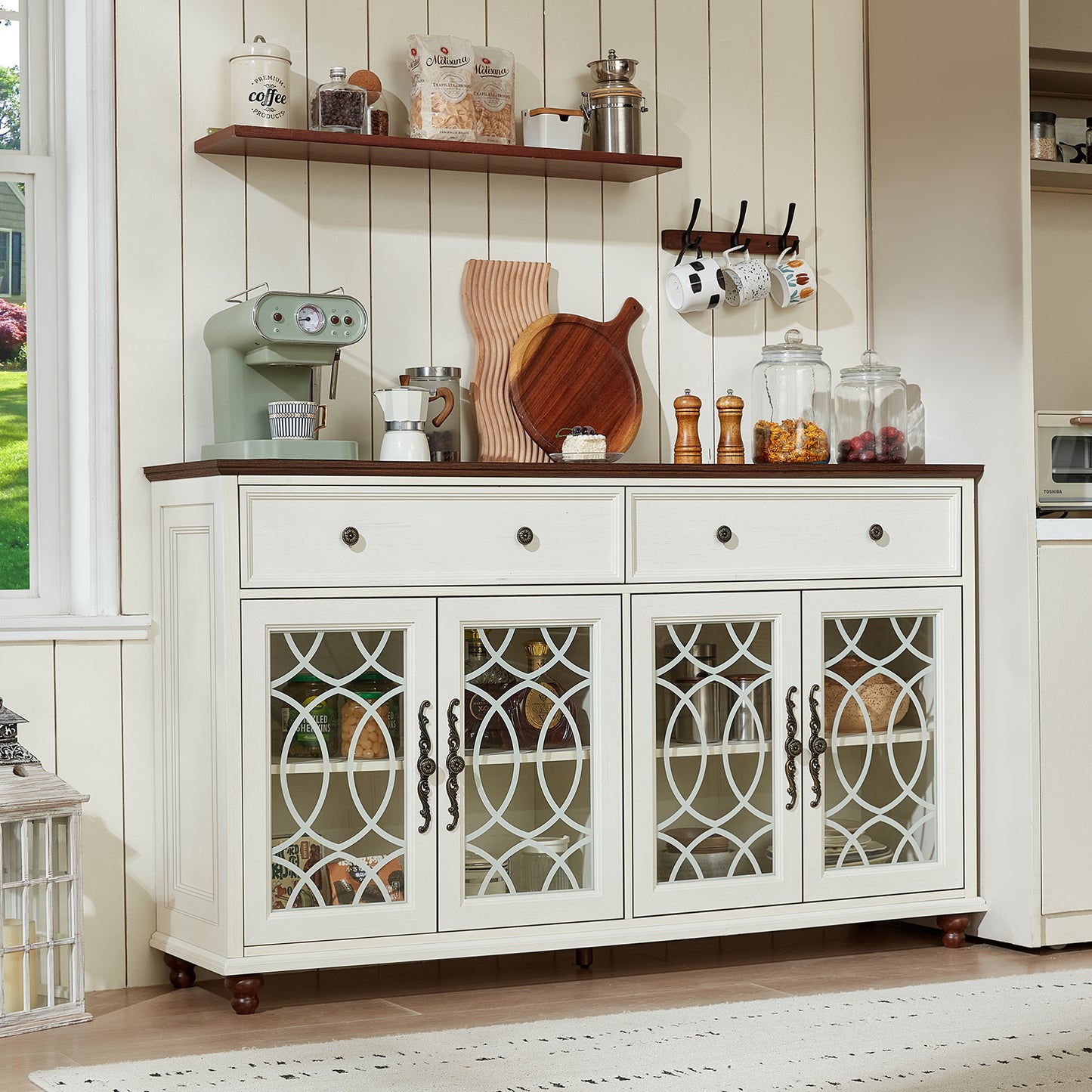 White sideboard cabinet with multiple drawers and arched glass door panels