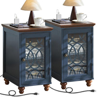 Navy blue bedside end table set with glass cabinet doors and charging cords at base