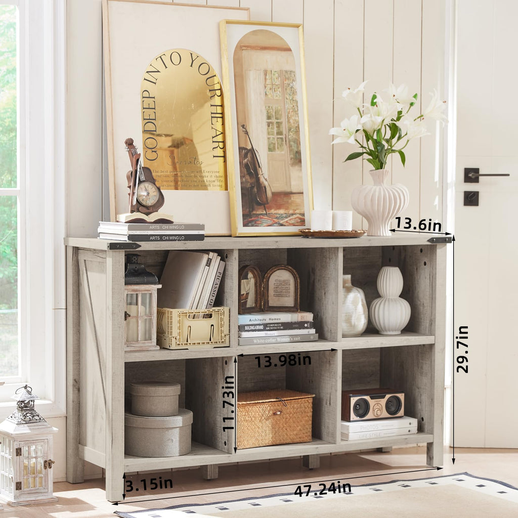 White farmhouse console bookcase with open shelves and legs, featuring books and boxes