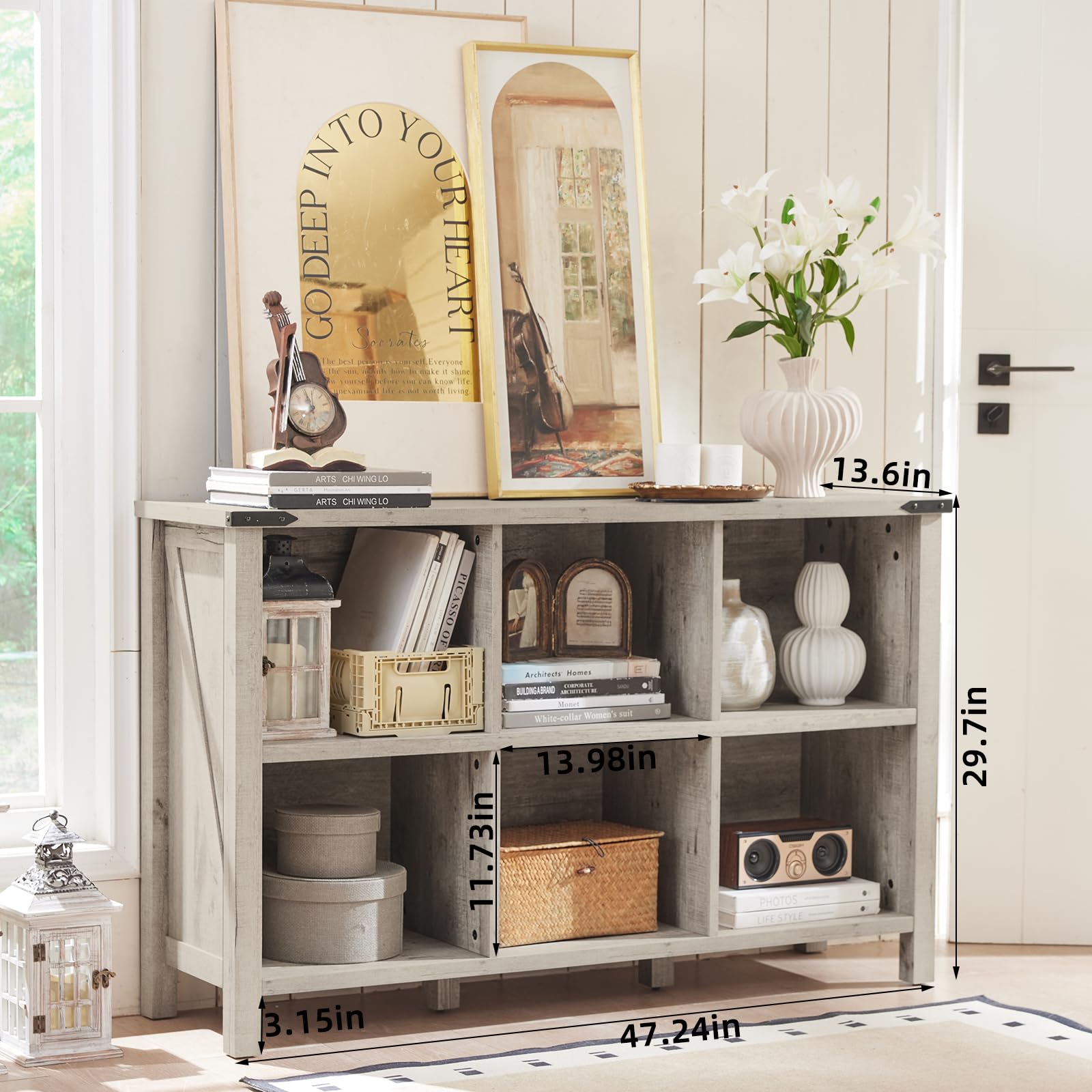 White farmhouse console bookcase with open shelves and legs, featuring books and boxes