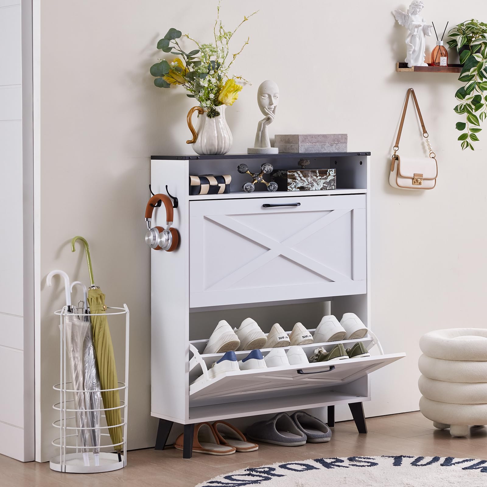 White shoe storage cabinet with two flip drawers, open rack holding shoes
