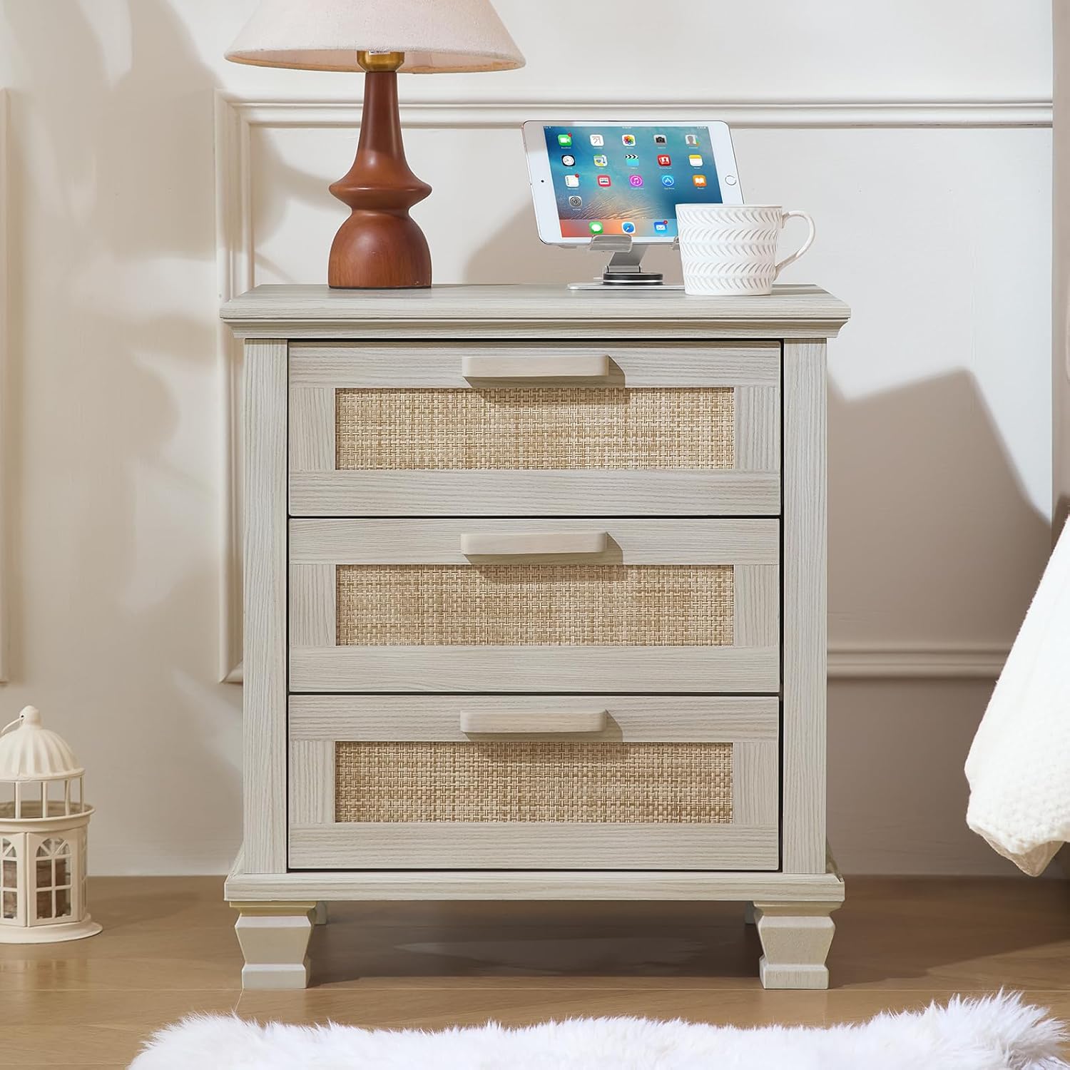 Wood bedside nightstand with three drawers and woven rattan fronts, open-lid profile