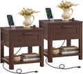 Set of two dark walnut nightstands with drawers, charging pads and cable management