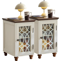 Pair of antique white wood nightstands with glass doors and dome lamps on top.
