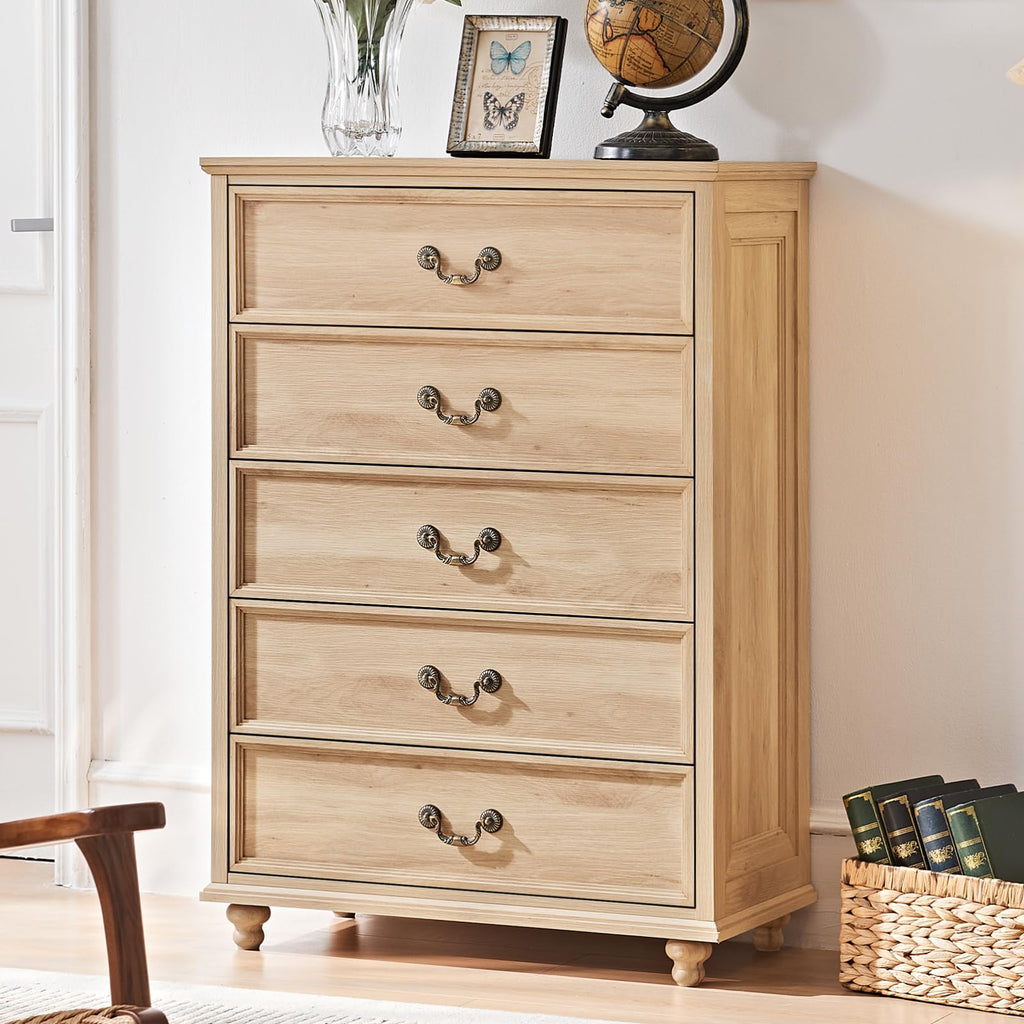 Natural wood dresser with four drawers and bronze knobs, on turned feet