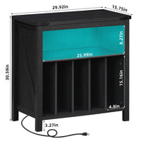 Black record player stand with open shelf for records and visible power cord at base