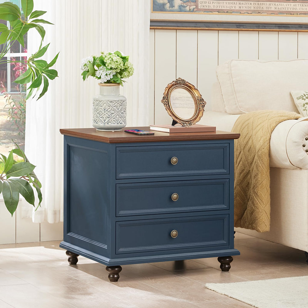 Navy blue 3-drawer dresser with round brass handles and short bun feet