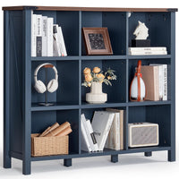 Dark navy console bookcase with open shelves, storing books, baskets, and small decor