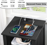 Black wooden nightstand with recessed power strip, USB ports, and charging area