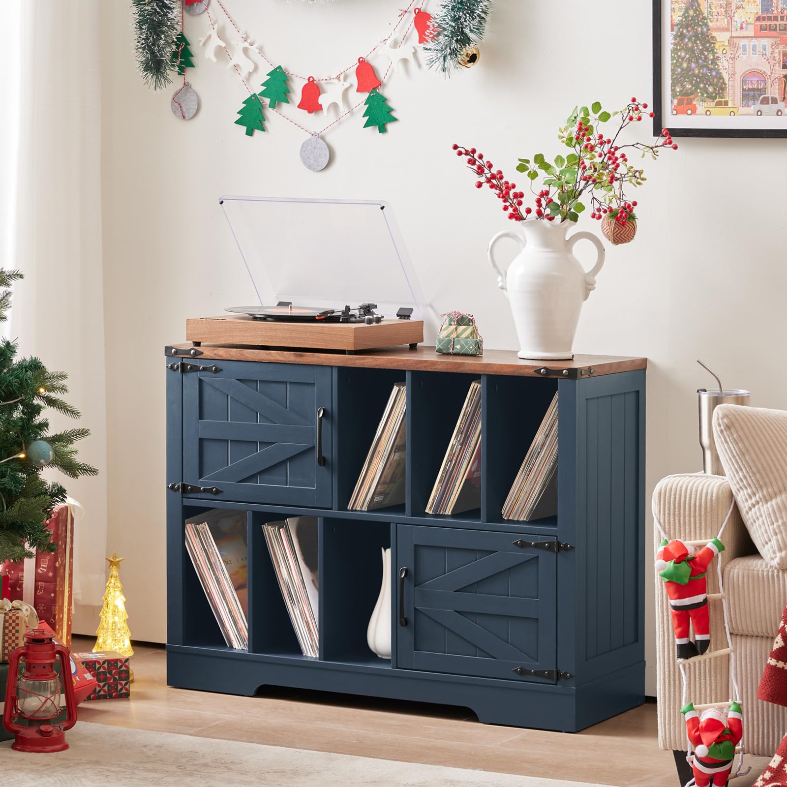 Navy blue wood record player cabinet with open shelves for vinyl records and barn doors.