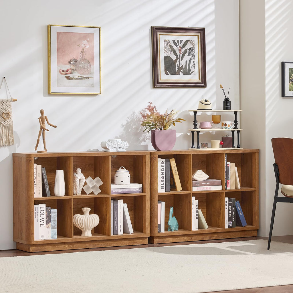 Natural oak low 8-cube bookcase with open cubbies and decorative items
