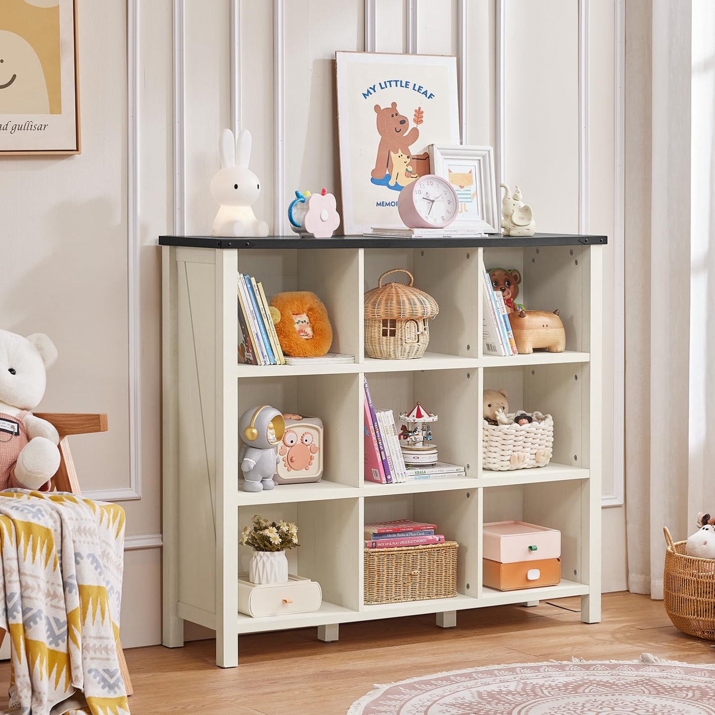 White farmhouse bookcase cabinet with open cubbies and four short legs, media and decor storage