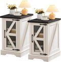 Set of white farmhouse bedside cabinets with black tops and glass barn door fronts