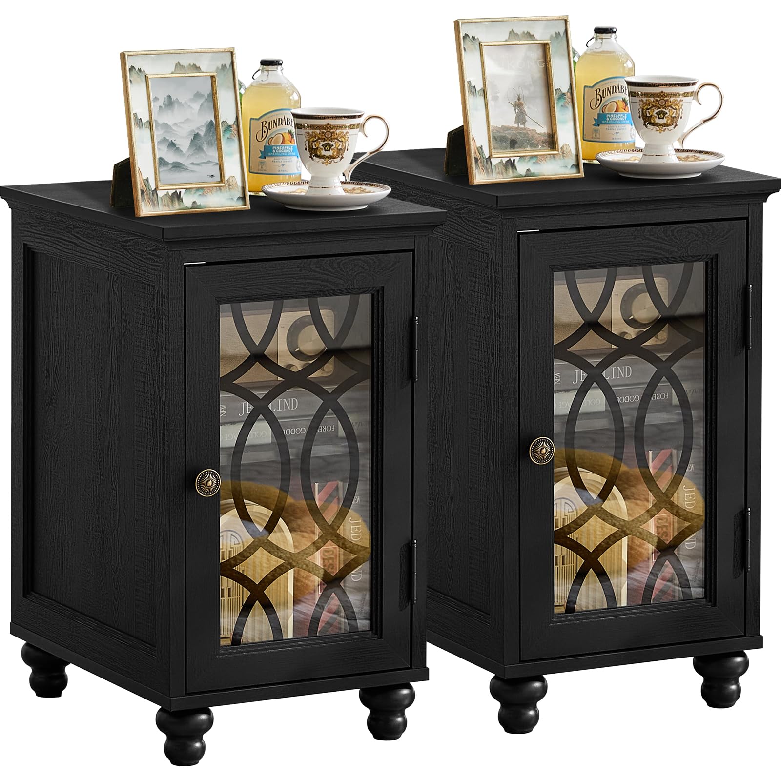 Pair of dark wood nightstands with glass cabinet doors and decorative accents on top.