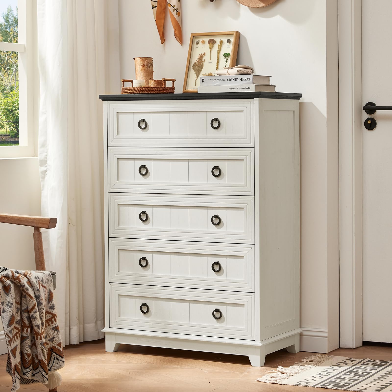 White painted wood dresser with four drawers and round metal knobs.