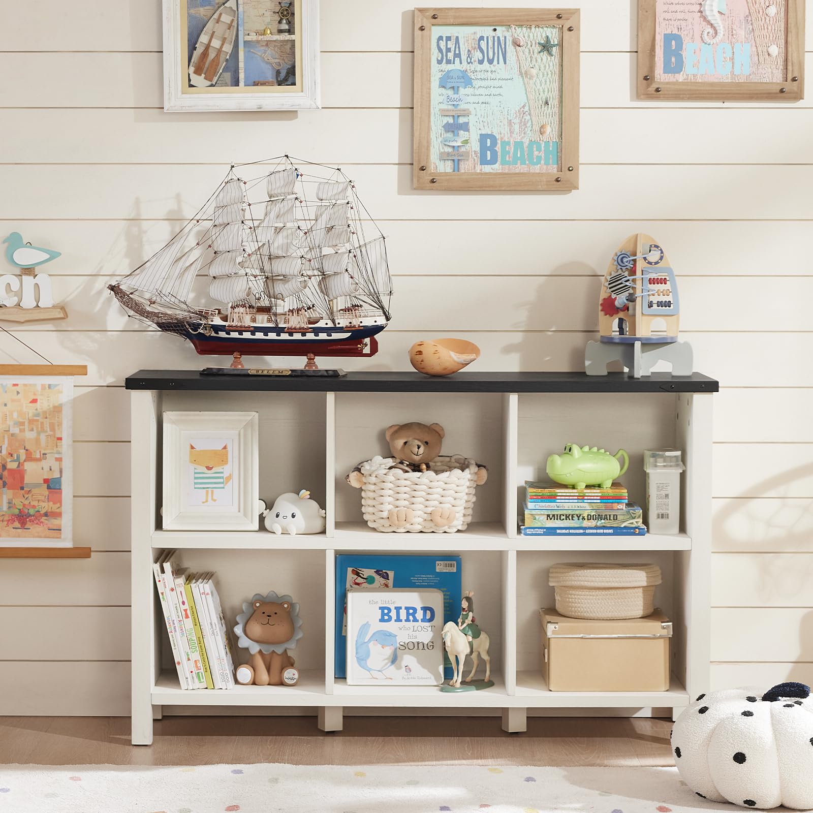 White low bookcase with open shelves for books and decorative display items