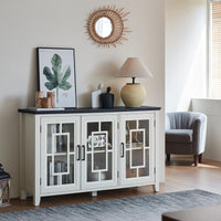 White buffet cabinet with glass doors, centered metal handles, and open storage compartments.
