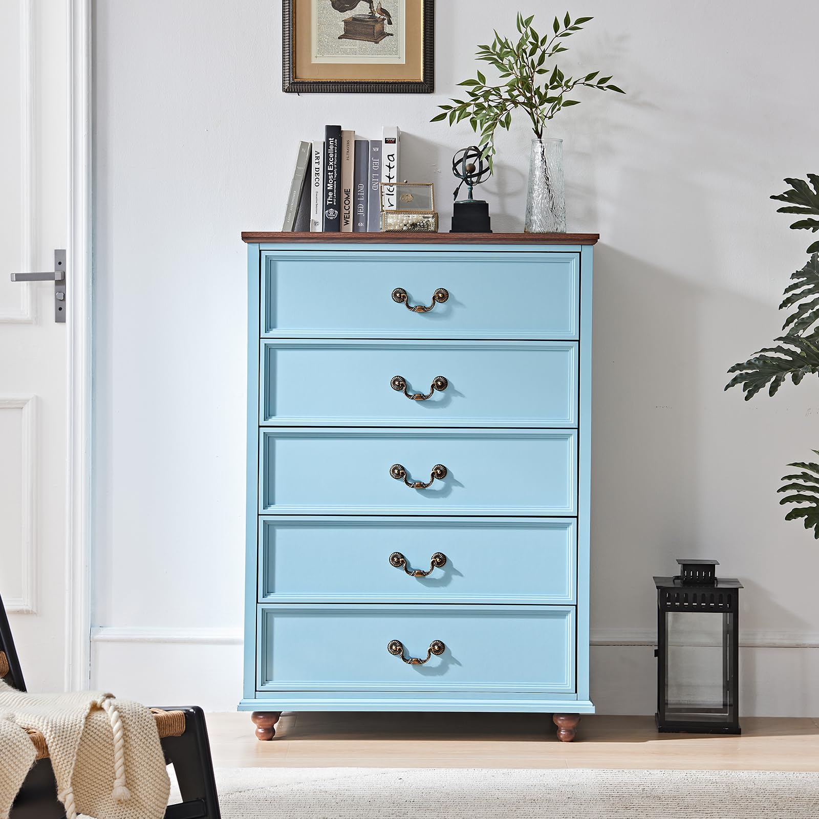 Light blue 5-drawer dresser with brass knobs and short wooden feet