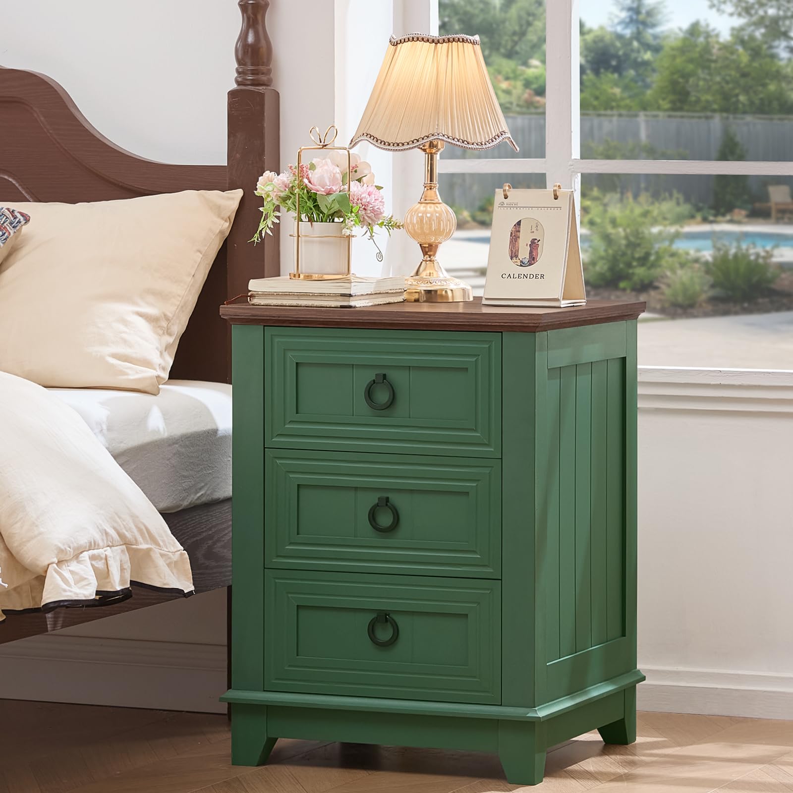 Green farmhouse nightstand with three drawers and round metal knob handles