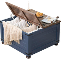 Blue farmhouse coffee table with open flip-top lid and hidden storage
