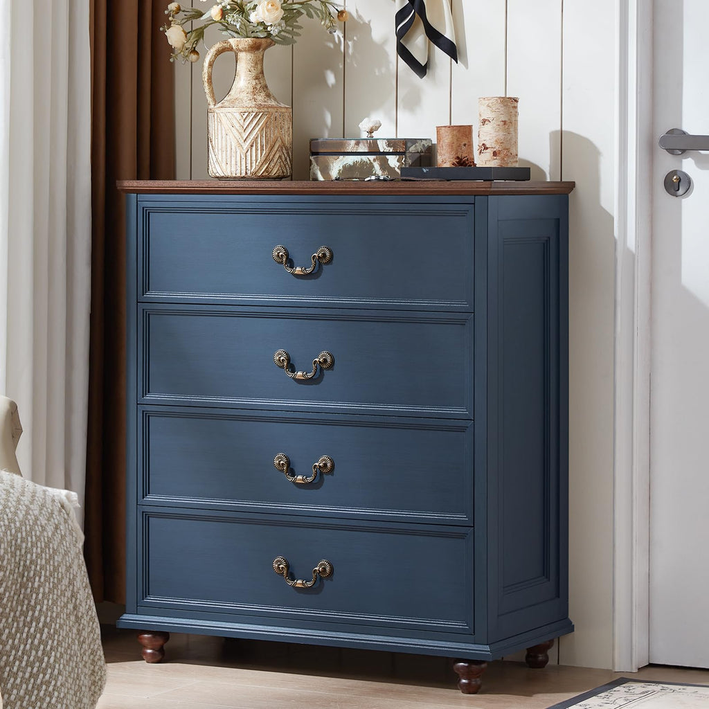 Navy blue 5-drawer dresser with metal cup pulls and short wooden feet.