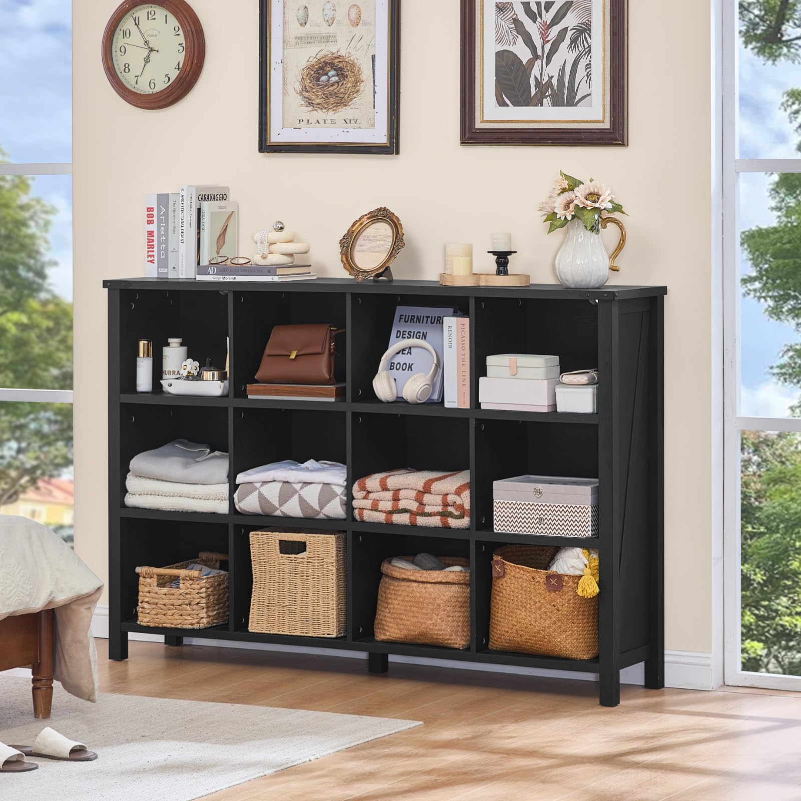 Dark low bookcase with open storage compartments and bottom legs for display