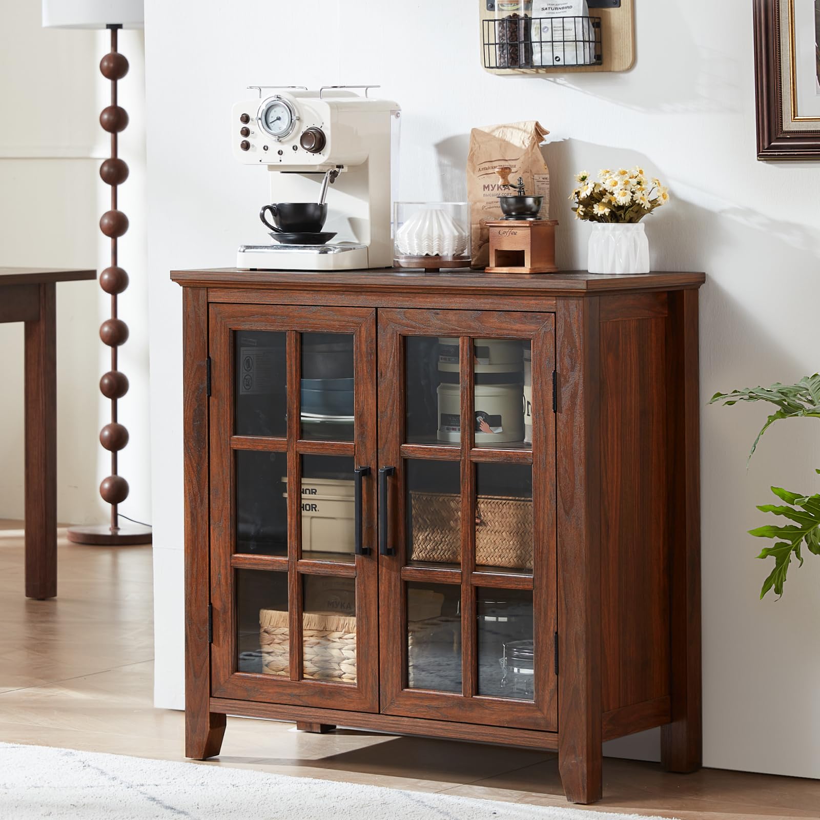 Brown sideboard cabinet with glass doors and two central metal pull handles.