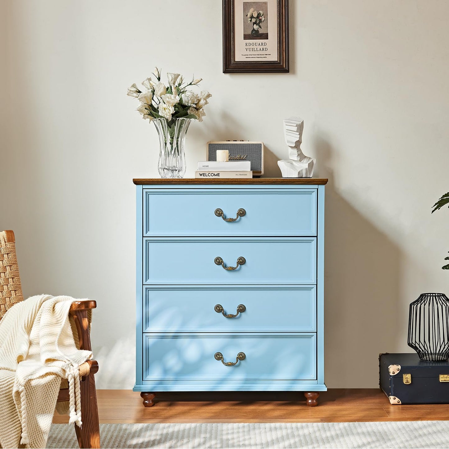 Blue farmhouse dresser with three drawers and curved metal pulls, on wooden feet