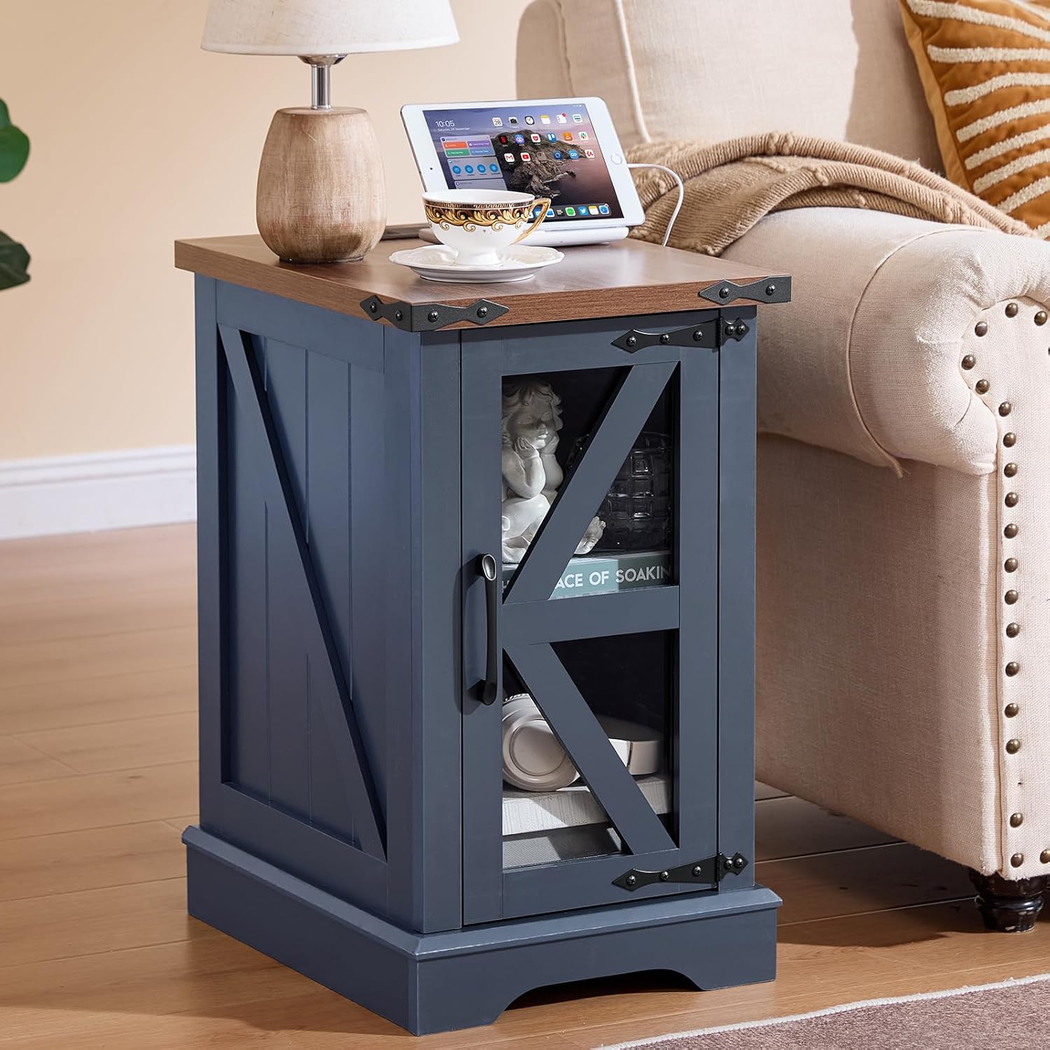 Dark blue lift-top side table with cabinet storage, holding a tablet on the top