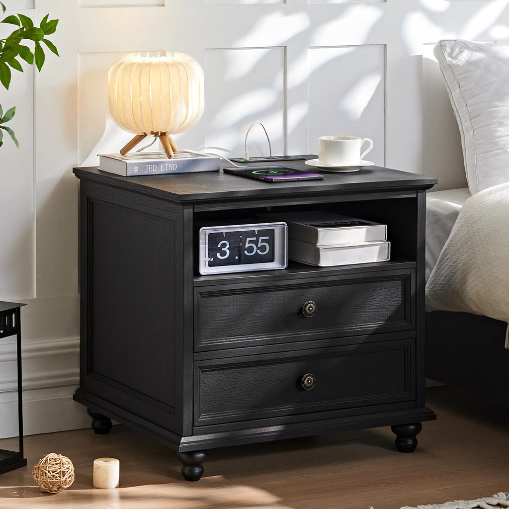 Black wooden dresser with two drawers, round knobs, and side feet.