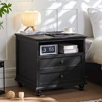 Black 5-drawer dresser with brass knobs and a drum lampshade on top