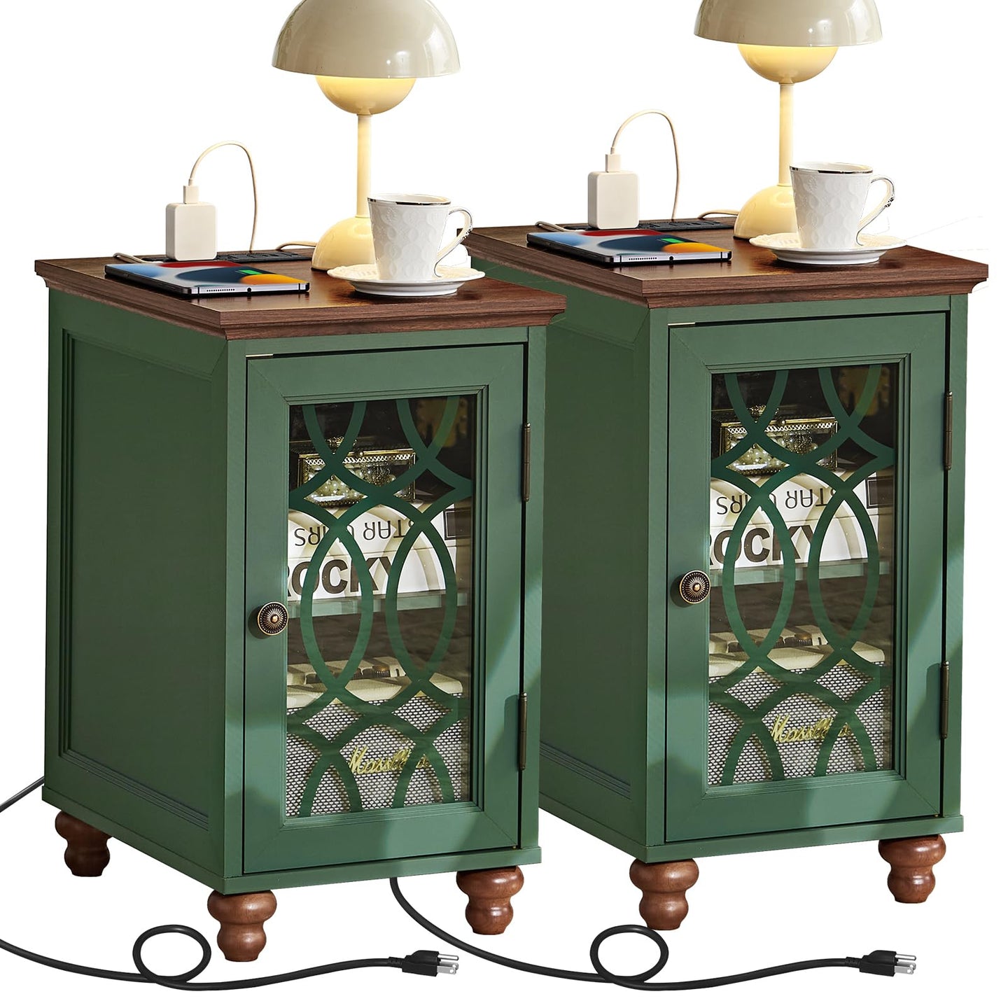 Green bedside end table set with glass cabinet doors and charging cords at base