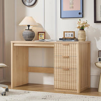 Natural wood desk with fluted cabinet panel and two cabinet drawers, metal handles