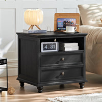 Black nightstand with three drawers, vintage brass knobs, and open side shelf