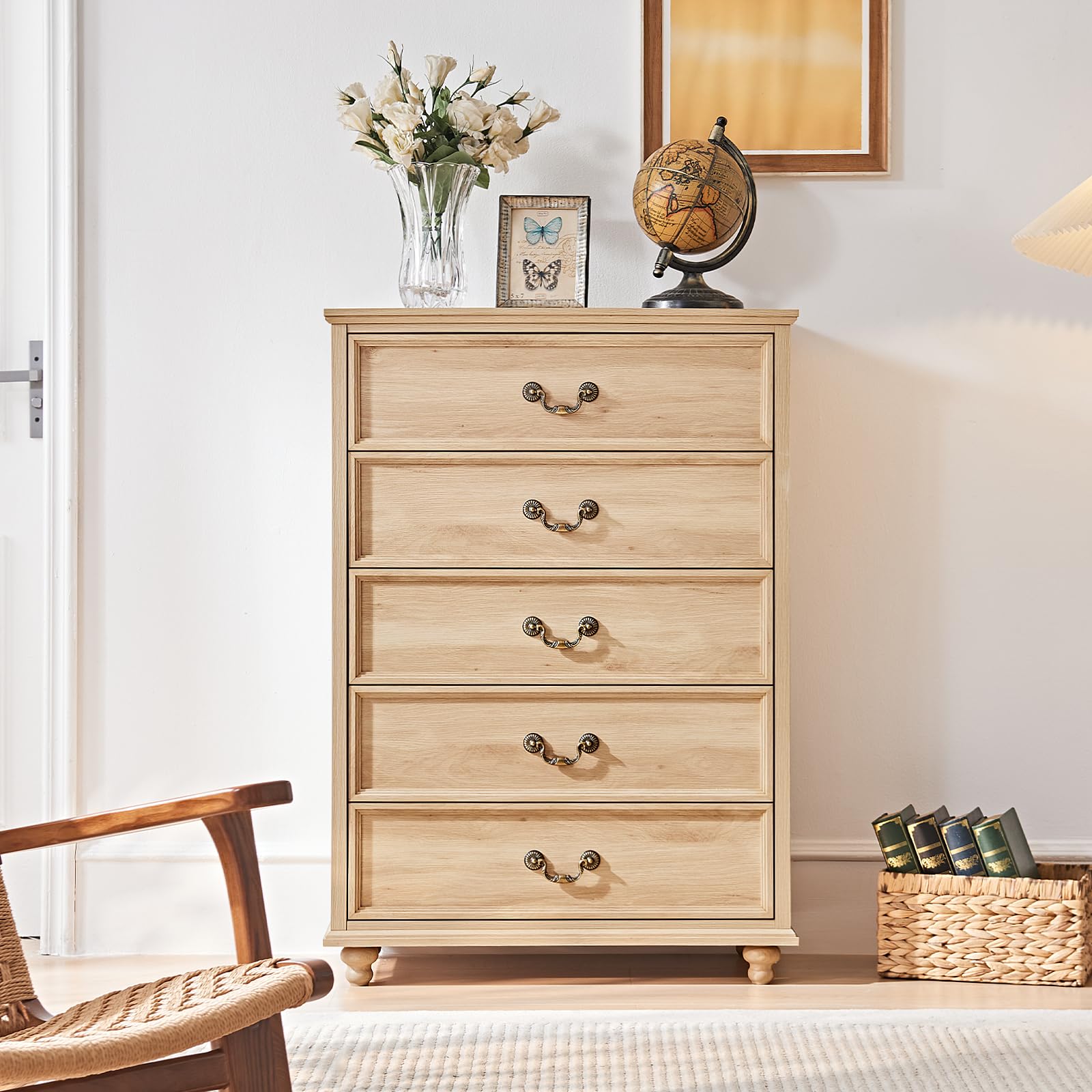 Light wood dresser with four drawers and curved metal pulls