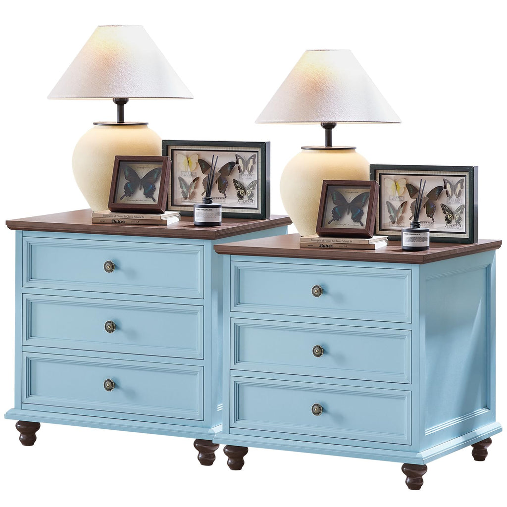 Light blue dresser with four drawers, bronze knobs, and turned wooden legs