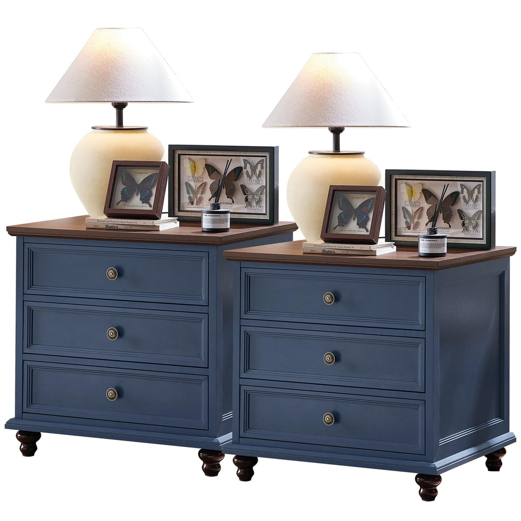 Blue 4-drawer dresser with brass cup handles, top decor, and carved wood feet.