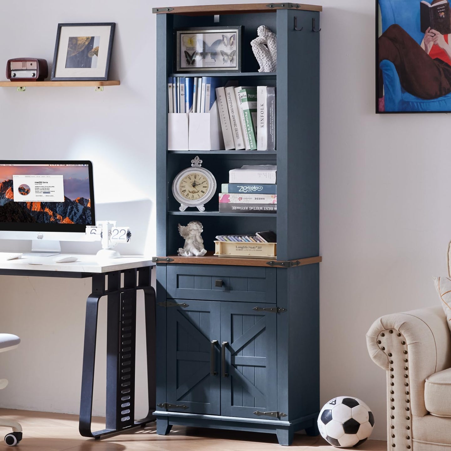 Dark blue bookcase with shelves, drawers, and barn-style doors