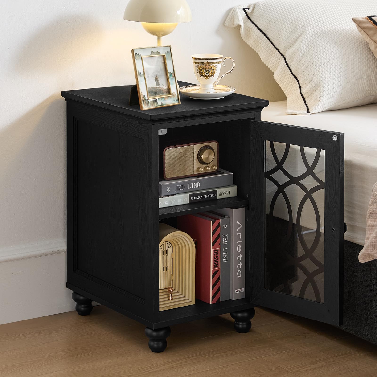 Black narrow nightstand with open cabinet, visible shelves, and glass door panel