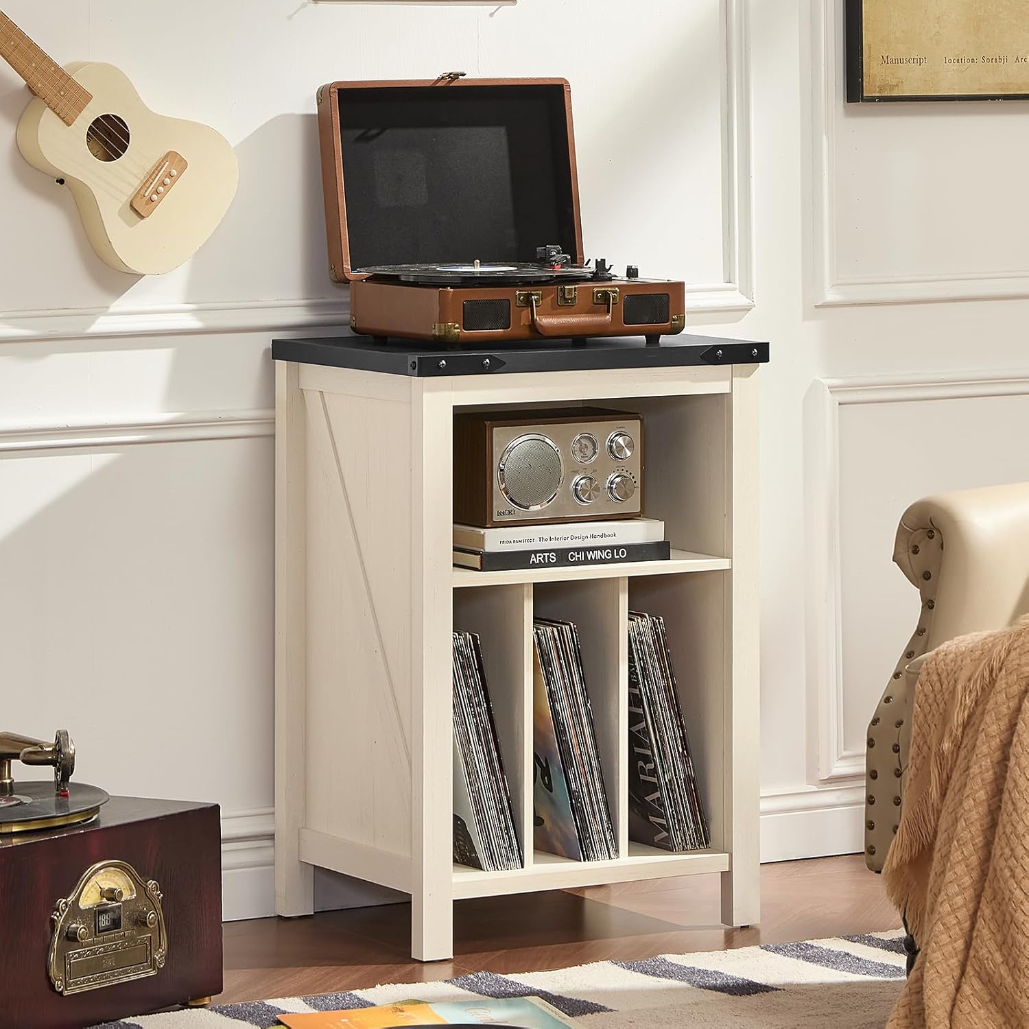White record player stand cabinet with open lid and vinyl records in front compartments