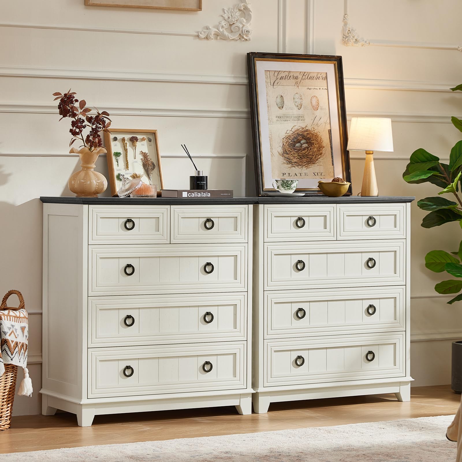 Farmhouse dresser with white finish and 5 drawers, with round metal knobs on fronts.