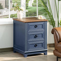 Navy nightstand with wood top and three drawers, round metal pulls