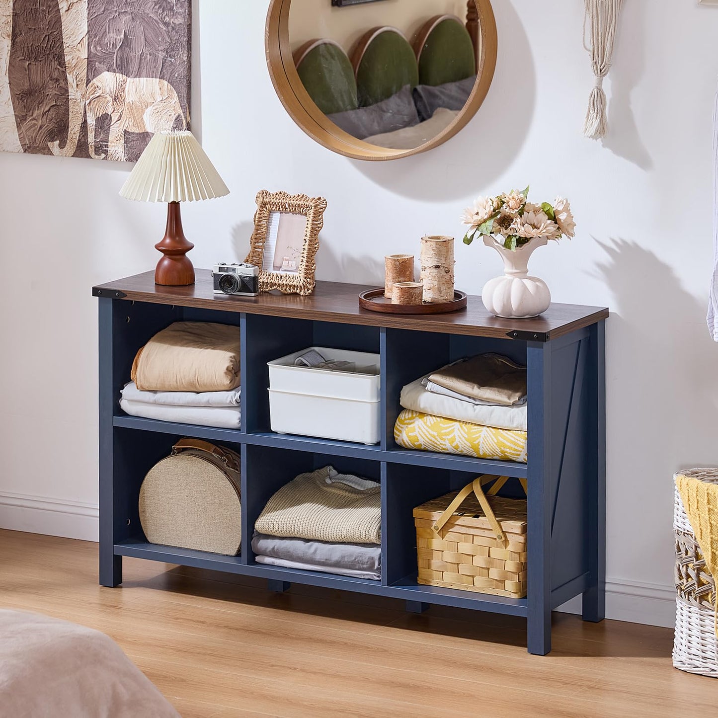 Green farmhouse-style bookcase with open cubby shelves and solid legs, console tabletop
