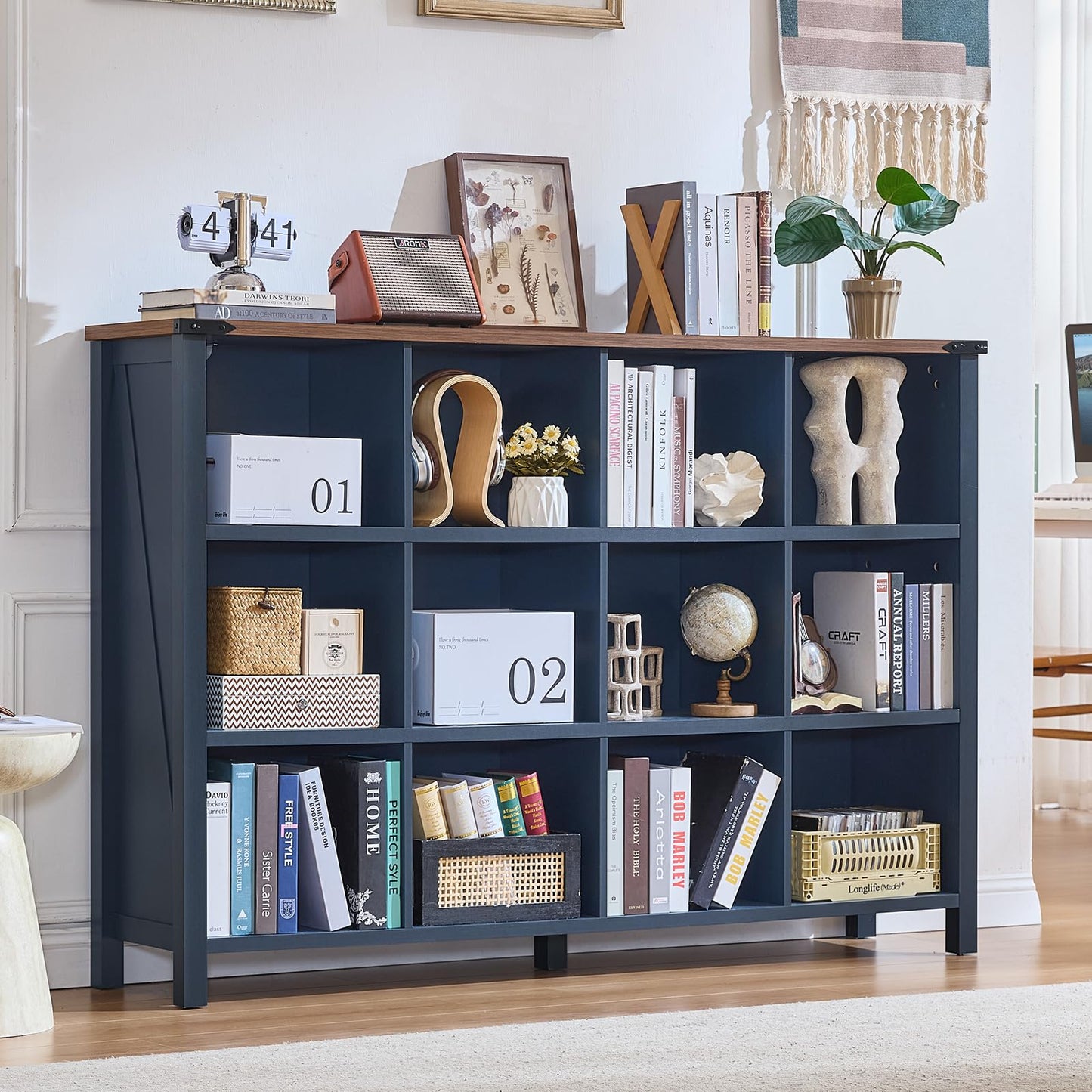 Dark navy farmhouse bookcase with open compartments, thick top, and four legs for books and decor